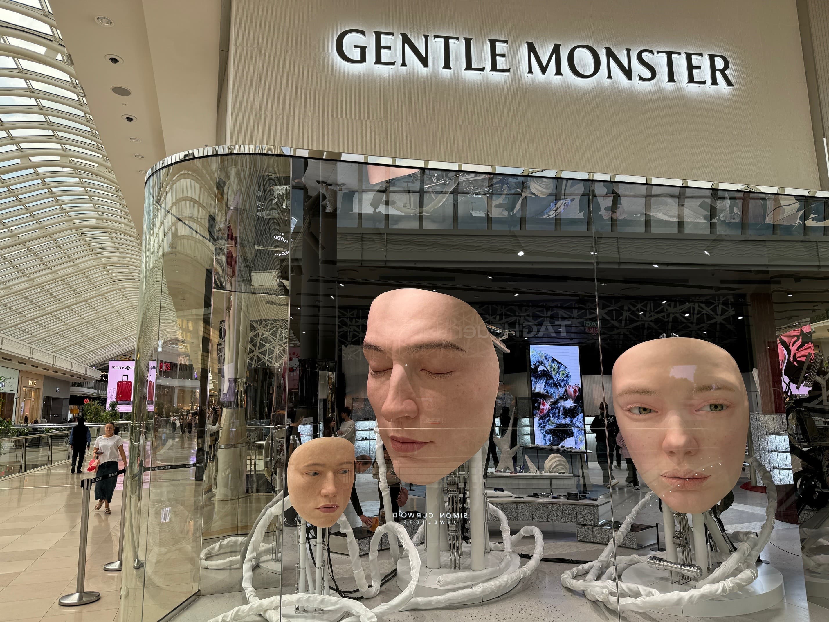 Large model faces in a shop window