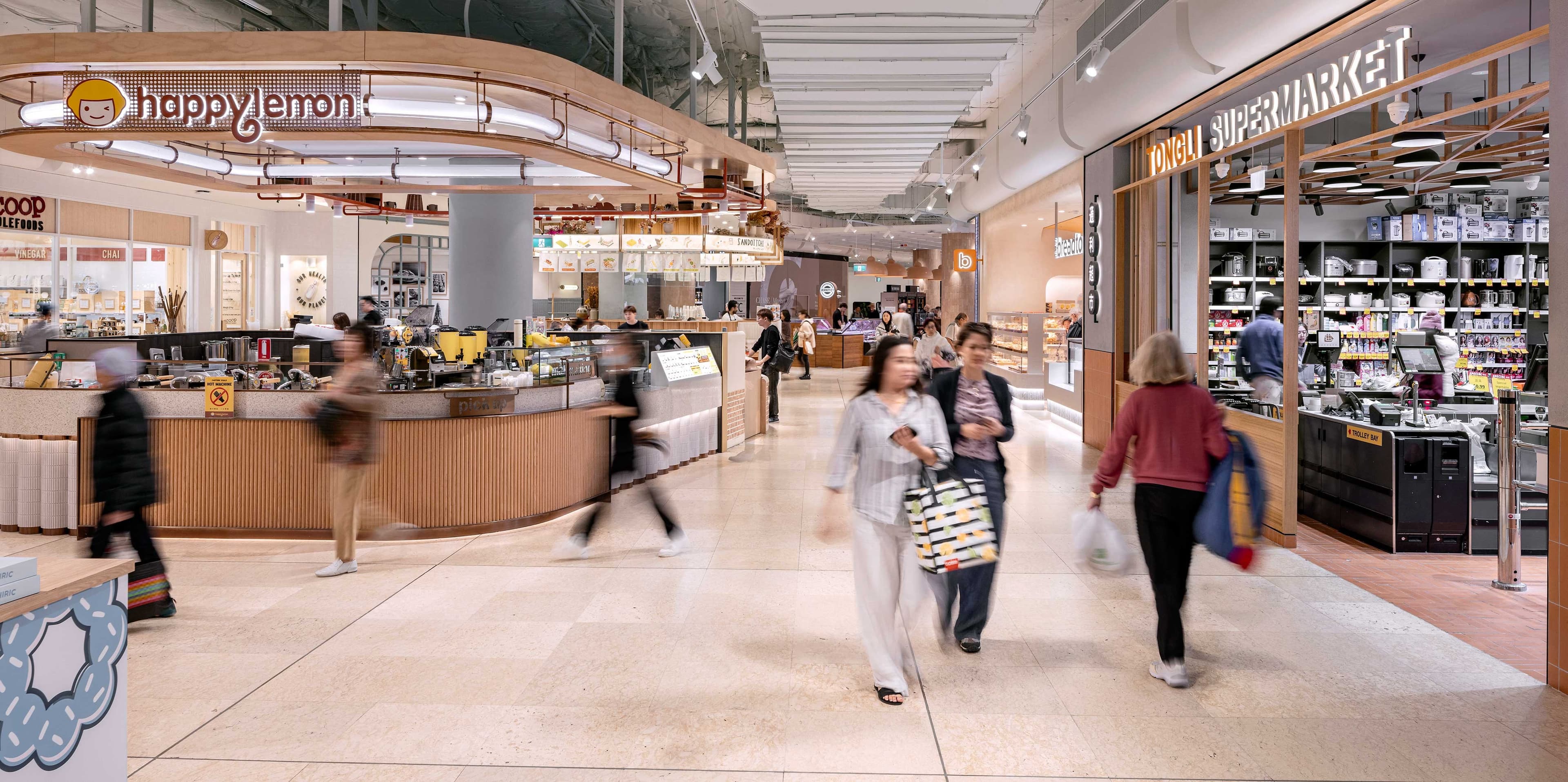 People walking through fresh food mall of Chatswood Chase