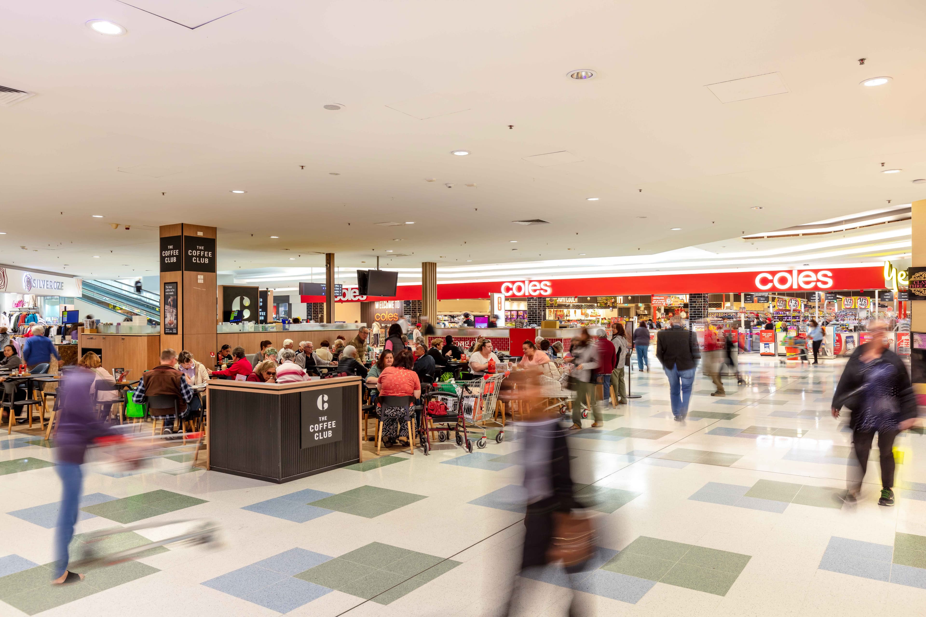 People in cafe and shopping in mall